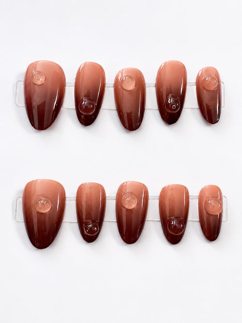 Amber ombre press-on nails with clear bubble accents