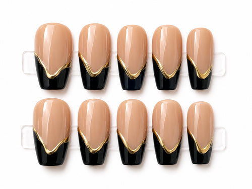 Medium nude square press-on nails with black French tips and gold V accents