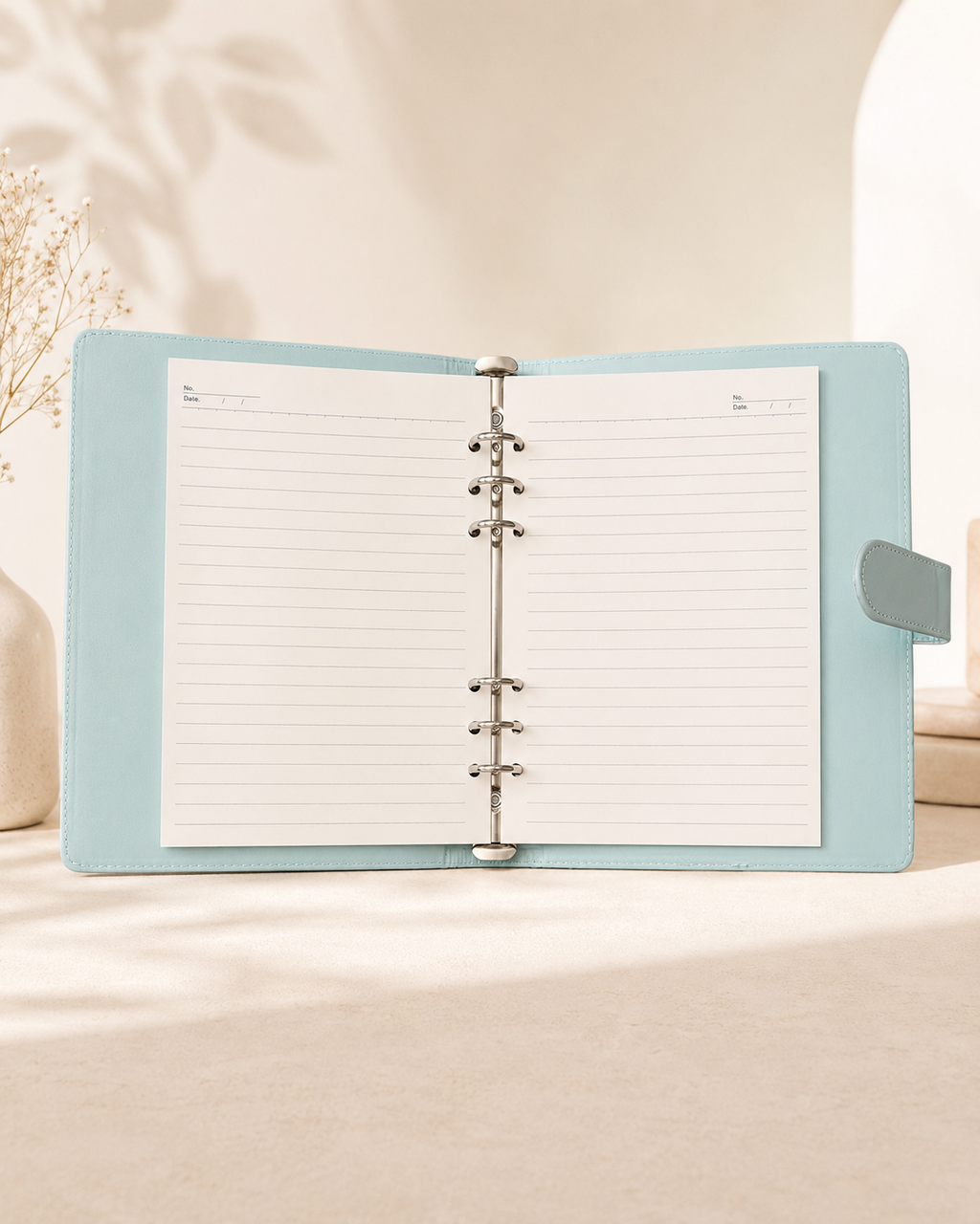 Pastel blue A5 binder open with lined paper inserts