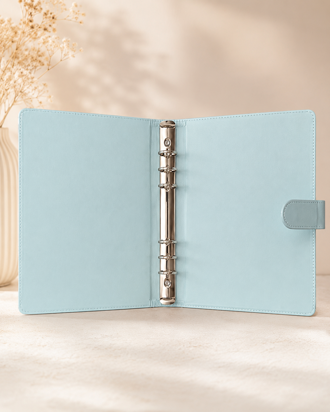 Pastel blue A5 binder open with silver ring mechanism