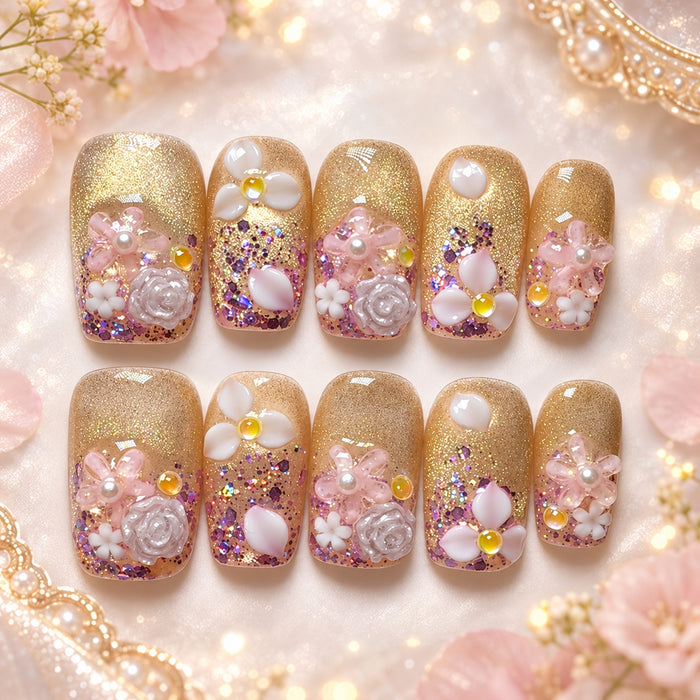 Short square gold glitter press-on nails with pink and white 3D flowers, roses and pearl accents