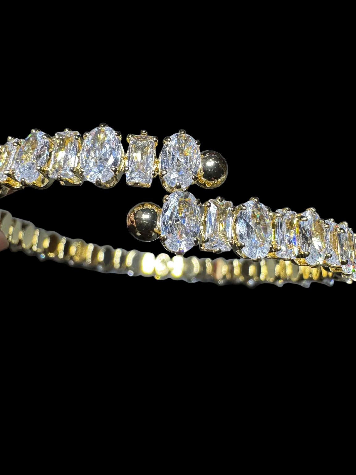 Open cuff ends and mixed-cut crystal details