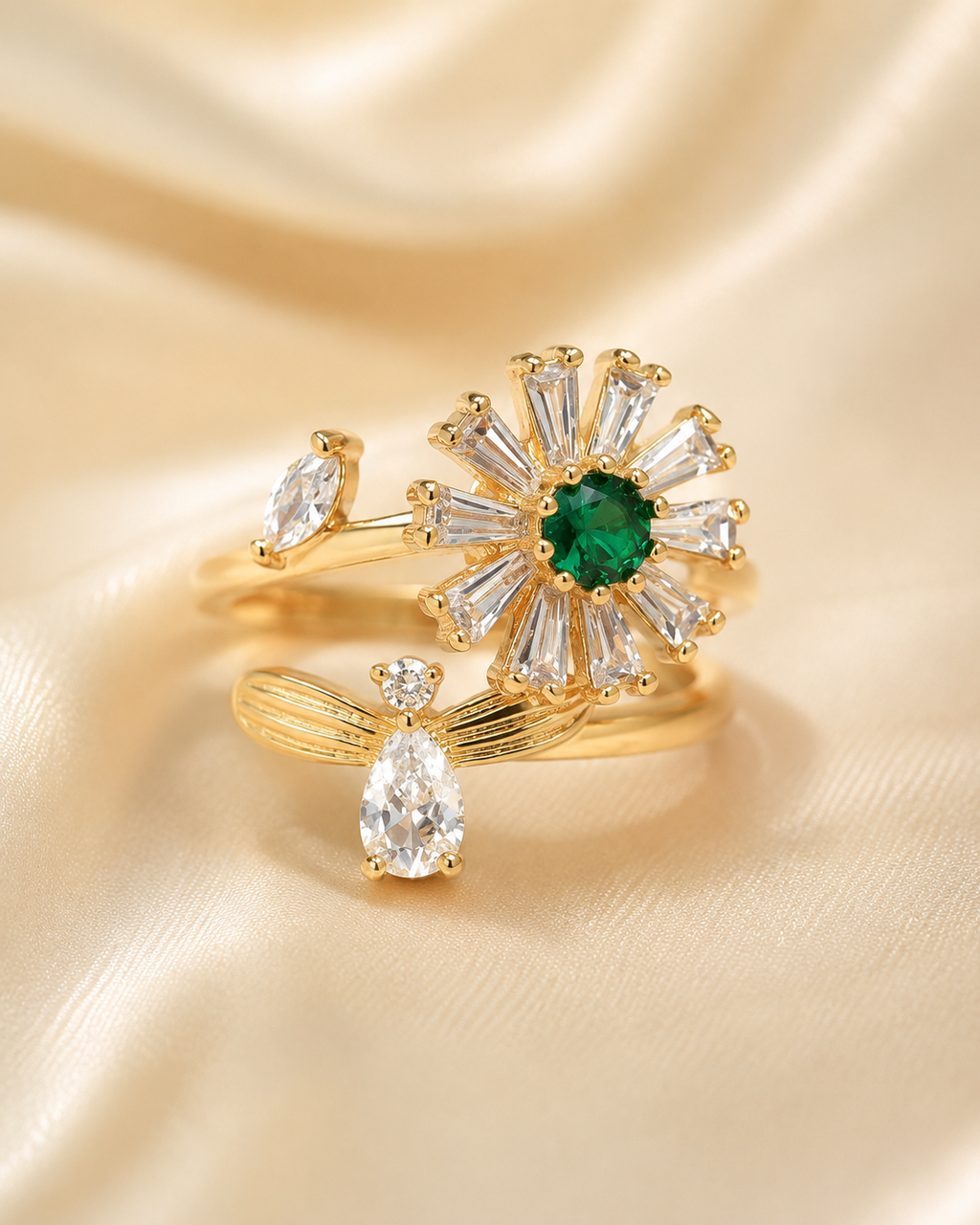 Adjustable stainless steel gold-tone spinner ring with green center stone and clear crystal accents