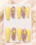 Lemon Lavender Bloom yellow press-on nails with purple and yellow 3D floral accents and rhinestones