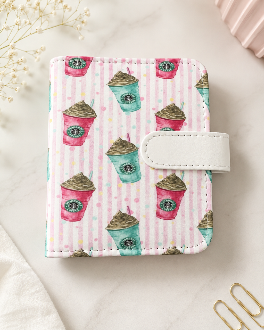 Pink coffee-themed M5 binder with white strap closure