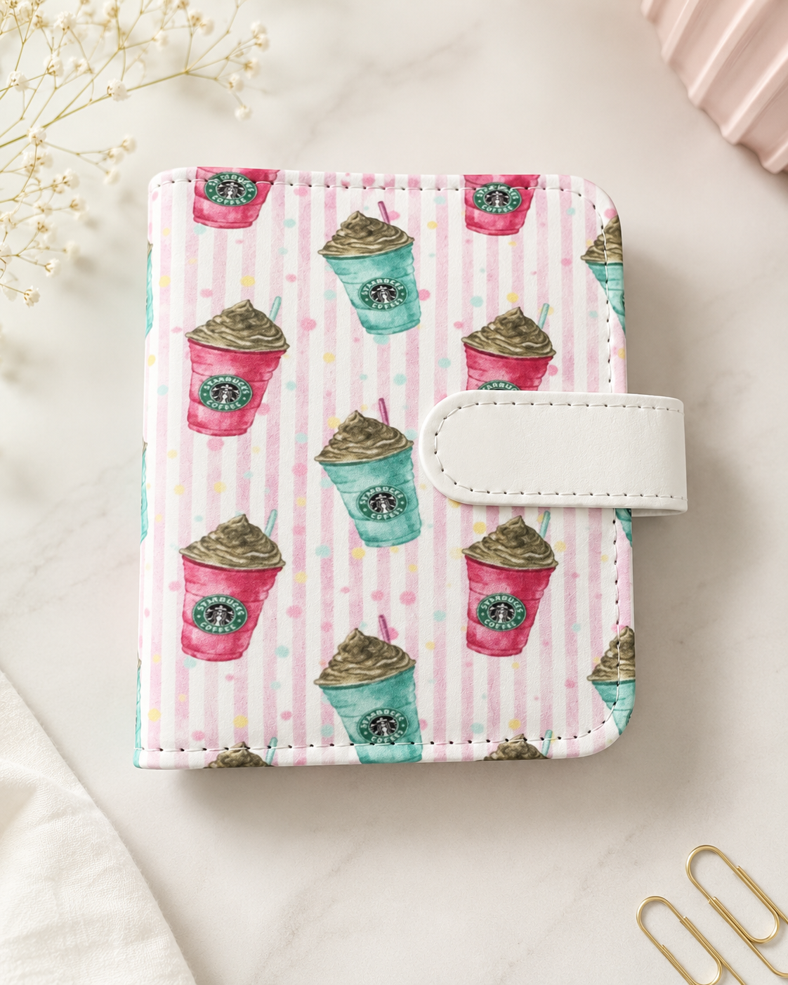 Pink coffee-themed M5 binder with white strap closure