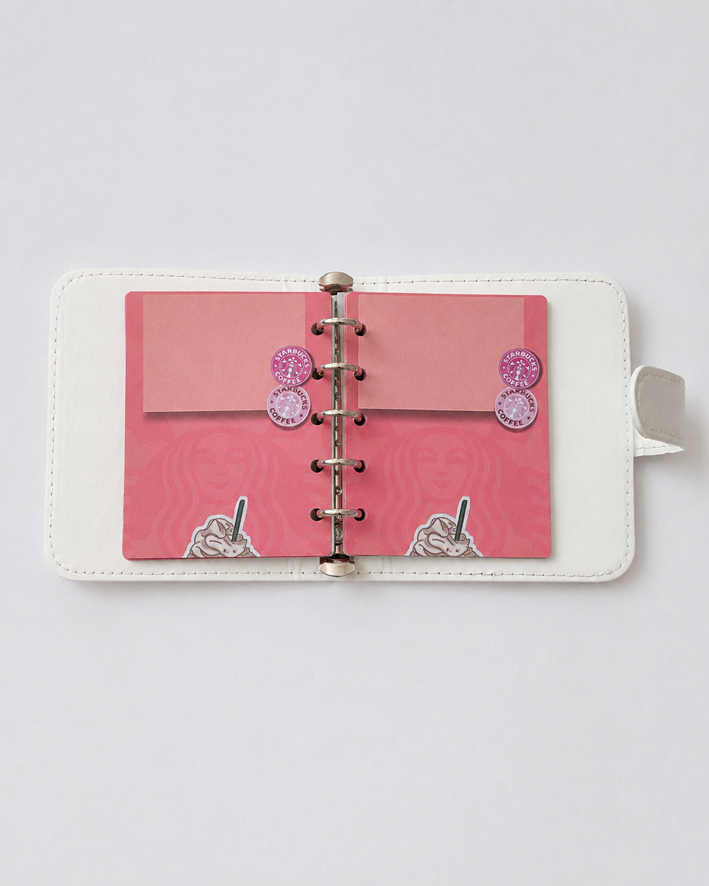 Open M5 binder with pink coffee-themed paper inserts