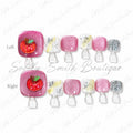 Pink glitter press-on toe nails with apple charms, white accents, and silver glitter