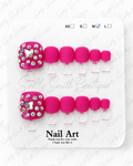 Pink Butterfly Bling press-on toenails in size medium