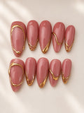 Rose pink press-on nails with sculpted gold accents