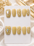 Short soft nude press-on nails with iridescent rhinestones