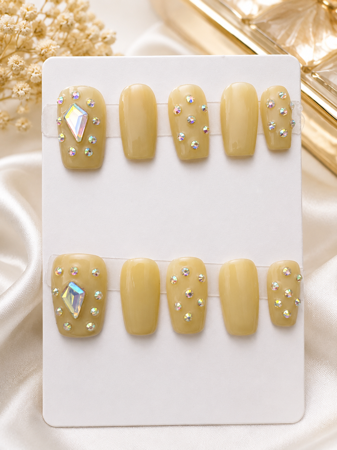 Short soft nude press-on nails with iridescent rhinestones