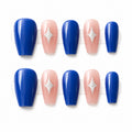 Small royal blue and pink press-on nails with silver star accents