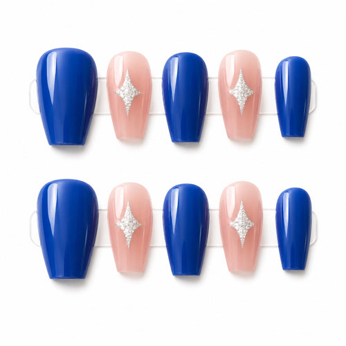 Small royal blue and pink press-on nails with silver star accents