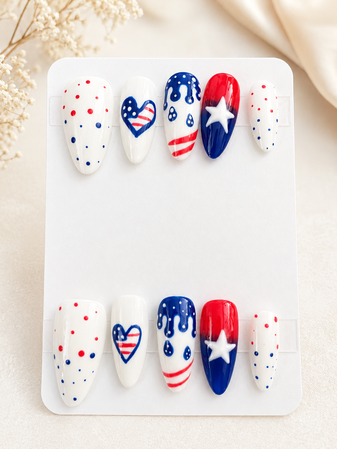 Star-Spangled Drip press-on nails in medium almond shape