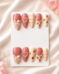 Strawberry plaid press-on nails with pearl, heart, and bow details